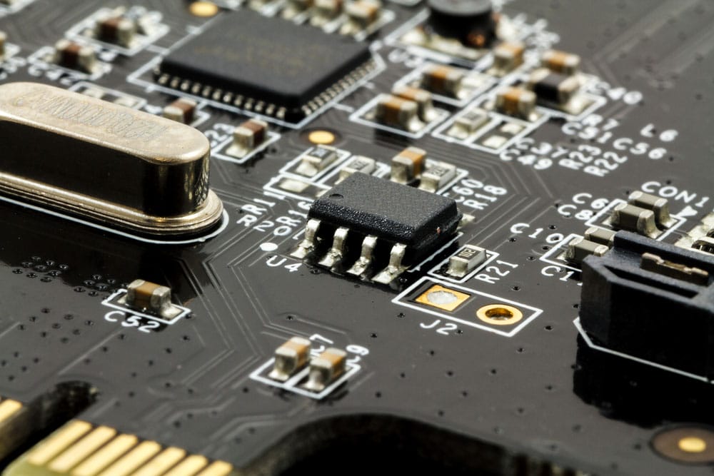 A PCBA with capacitors, resistors, and integrated circuits mounted on the PCB