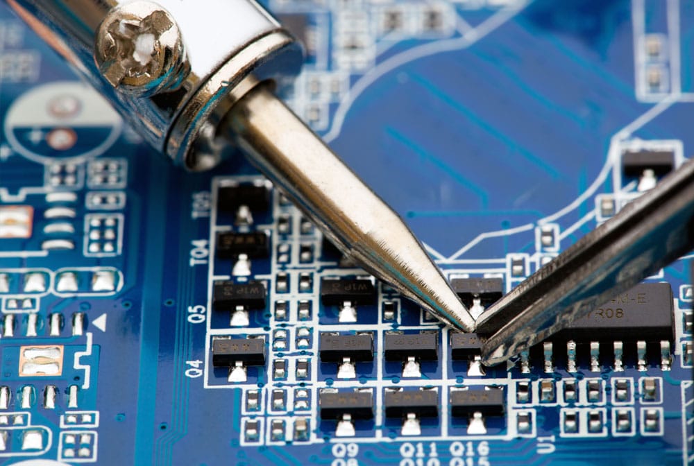 A solder gun used to repair a solder joint and the attached electronic component