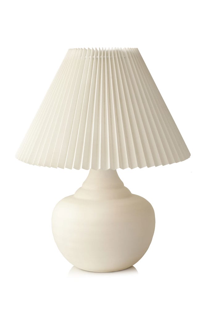 Woman Fixing Lamp