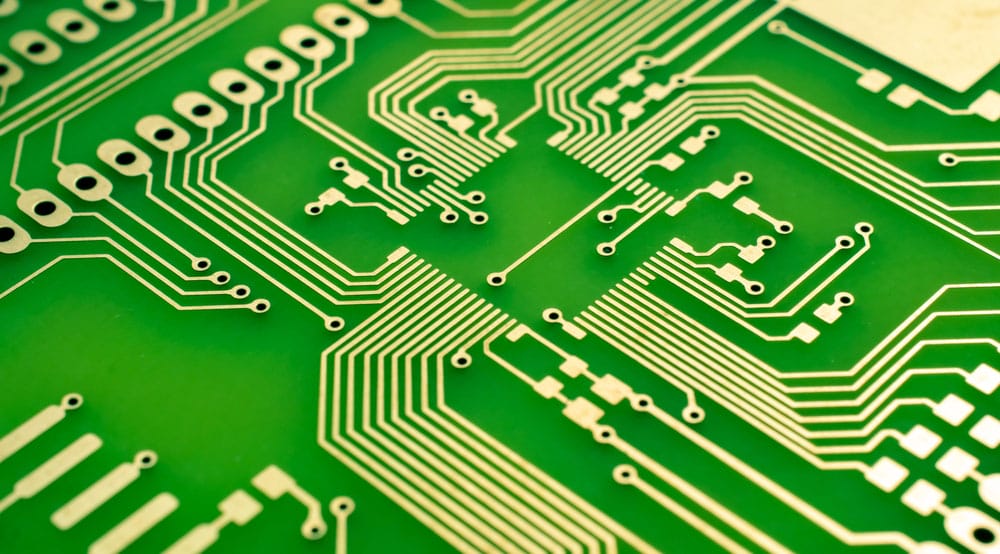 A PCB with green FR-4 substrate layers